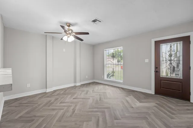 a view of an empty room with a window