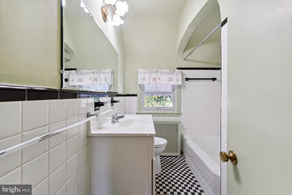 2432 Keyway Dundalk, MD 21222 - Photo 23 of 33 Classic Black/White Tiled Bathroom w/ Arch Detail
