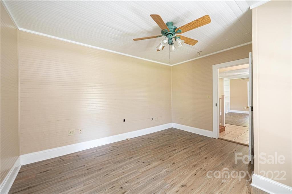 4313 Plateau Road Newton, NC 28658 - Photo 34 of 47 an empty room with wooden floor and fan