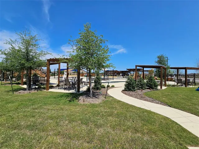 a view of a house with backyard porch and sitting area
