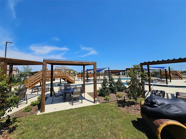 a view of a swimming pool with a patio