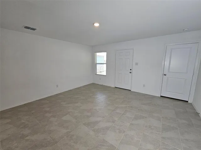 a view of an empty room and window