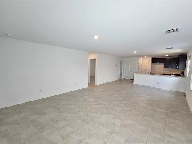 a view of a livingroom and a kitchen
