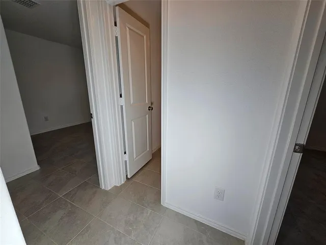 a view of a hallway with closet