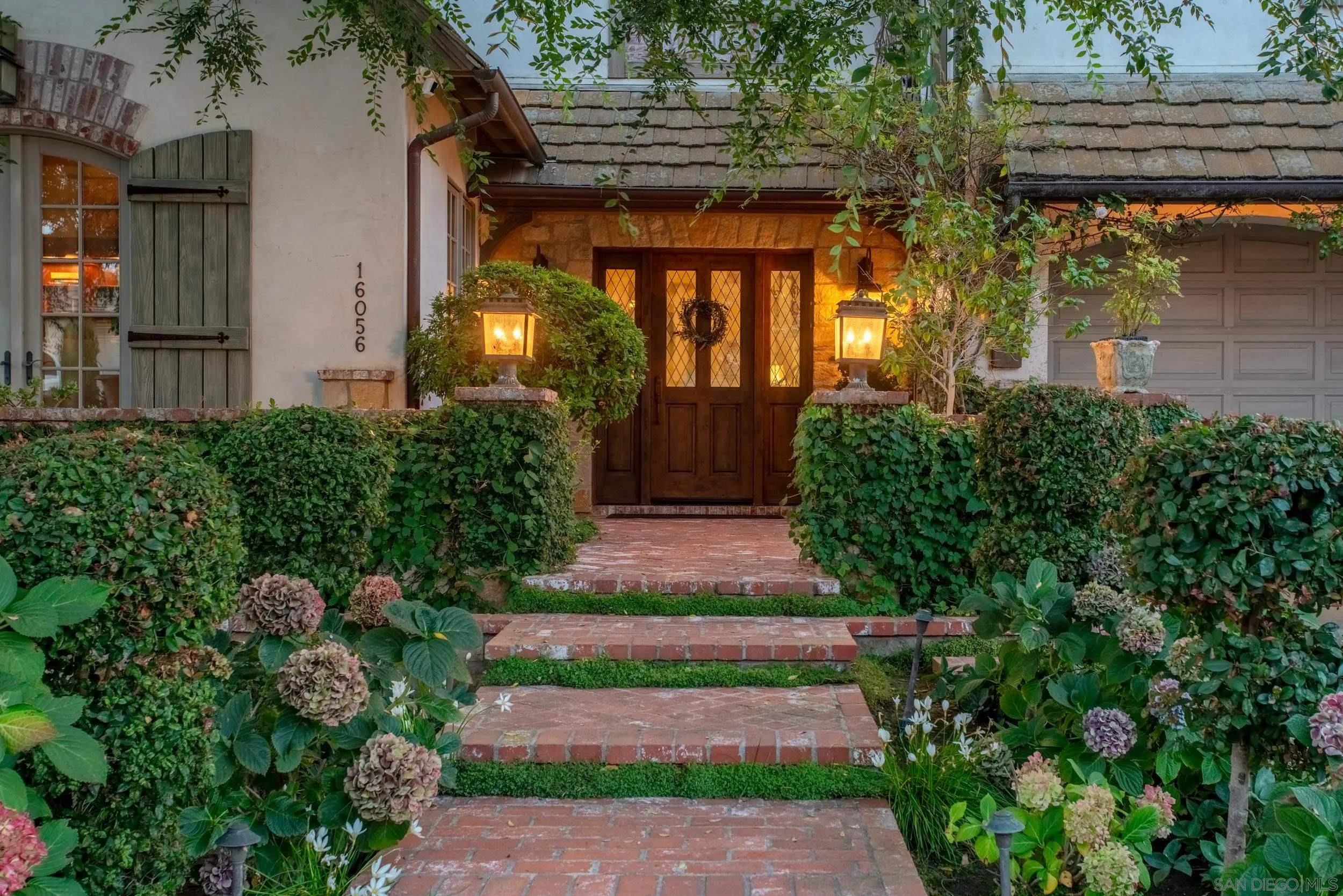 16056 Avenida Calma Rancho Santa Fe, CA 92091 - Photo 19 of 51 a front view of a house with a yard