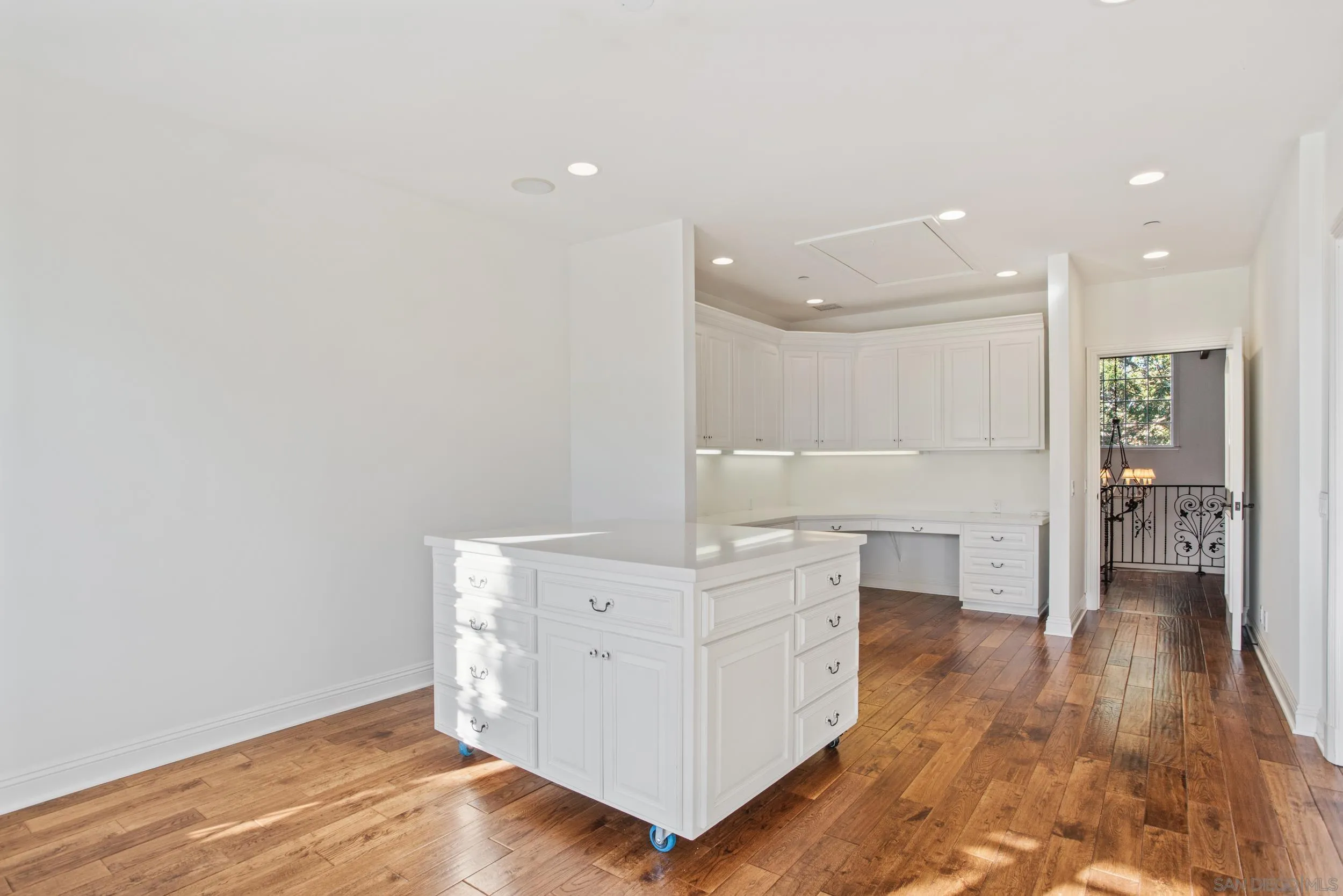 16056 Avenida Calma Rancho Santa Fe, CA 92091 - Photo 22 of 51 a view of cabinets with wooden floor and window