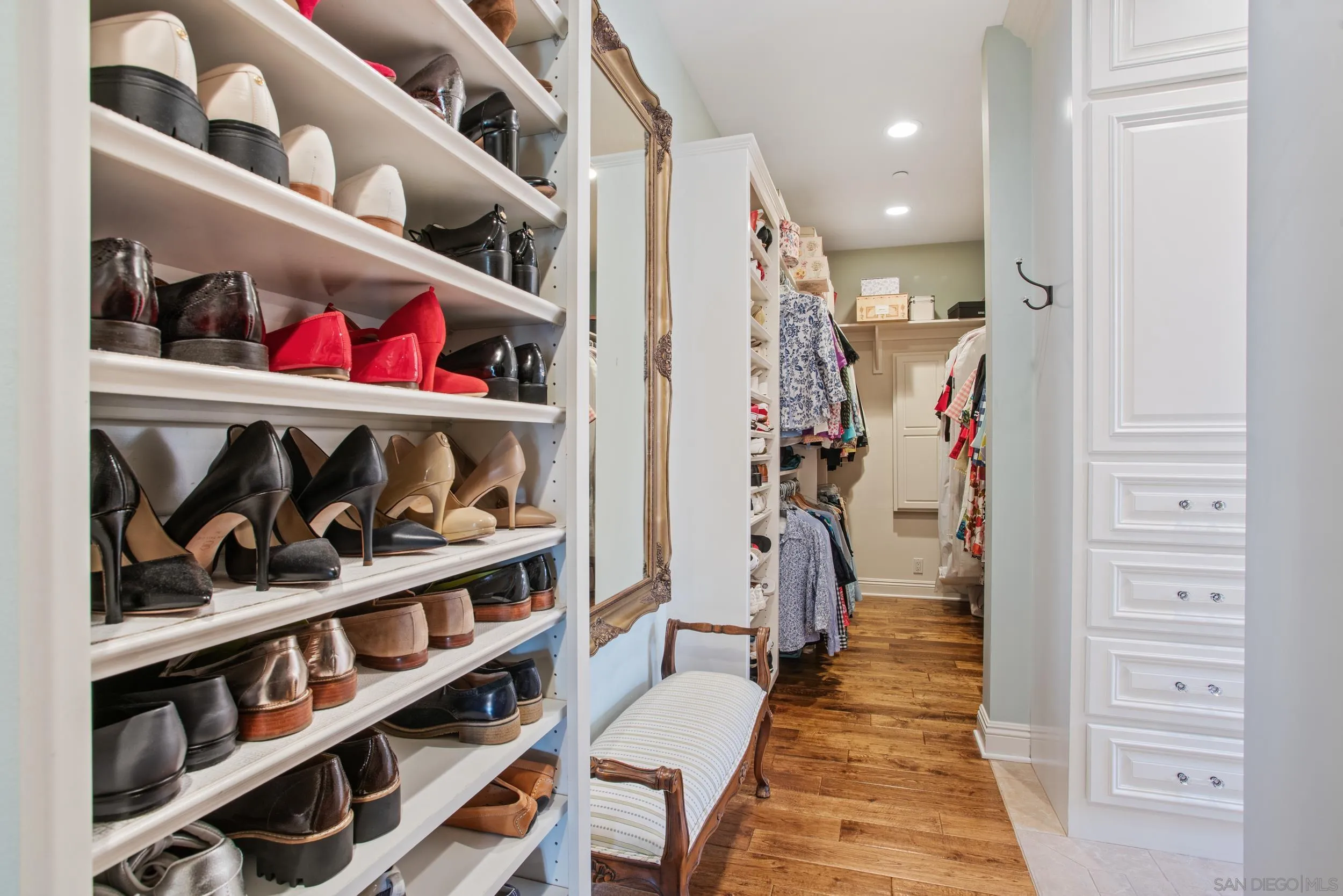 16056 Avenida Calma Rancho Santa Fe, CA 92091 - Photo 29 of 51 a view of walk in closet with clothes and shoes