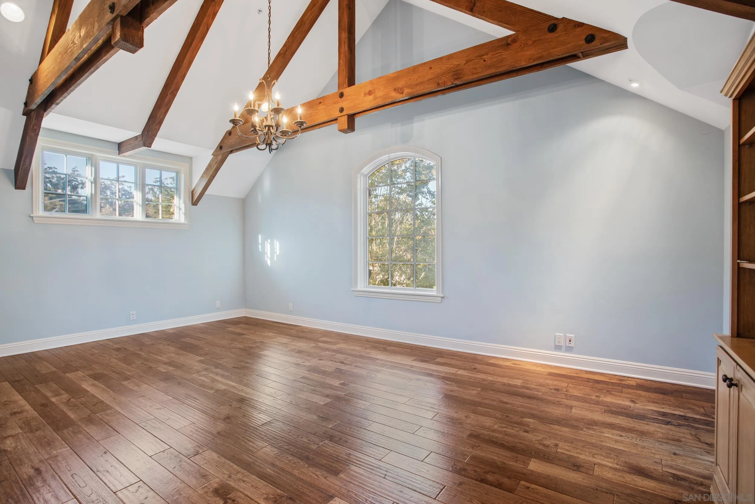 16056 Avenida Calma Rancho Santa Fe, CA 92091 - Photo 30 of 51 a view of an empty room with wooden floor and a window