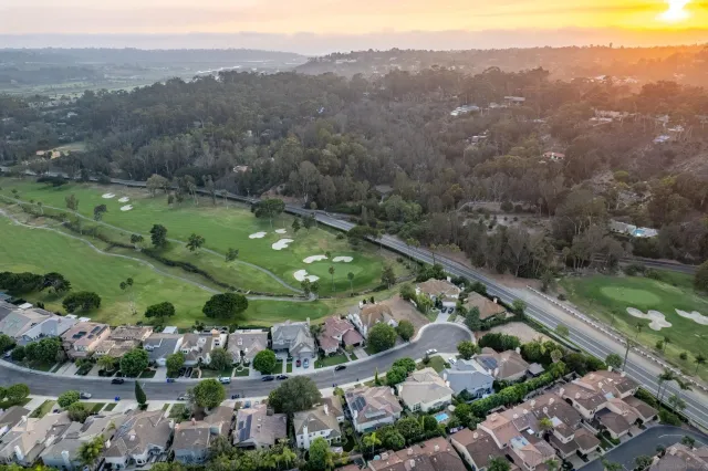 an aerial view of lake residential houses with outdoor space and trees