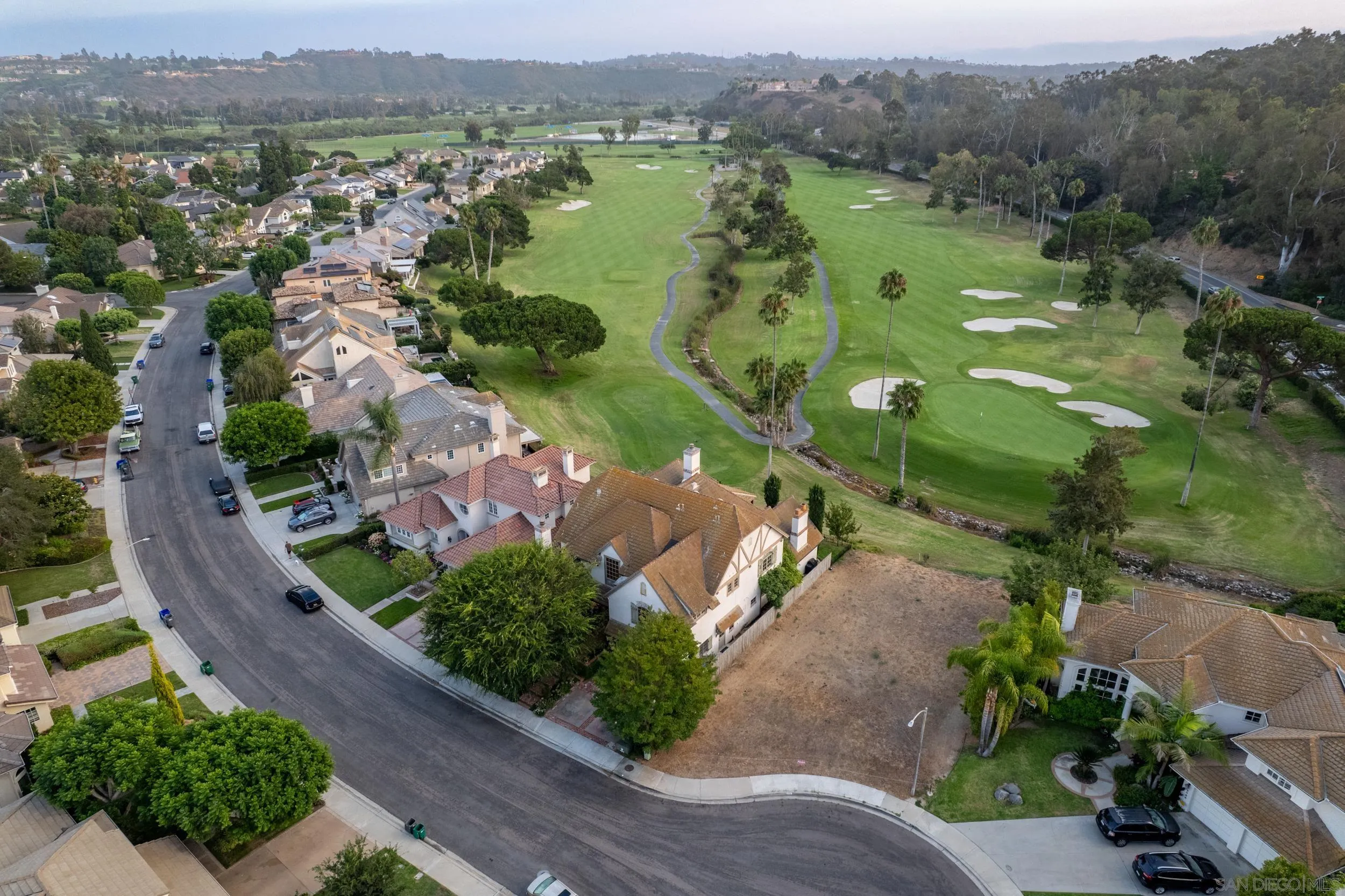 16056 Avenida Calma Rancho Santa Fe, CA 92091 - Photo 49 of 51 an aerial view of green landscape with trees houses and mountain view