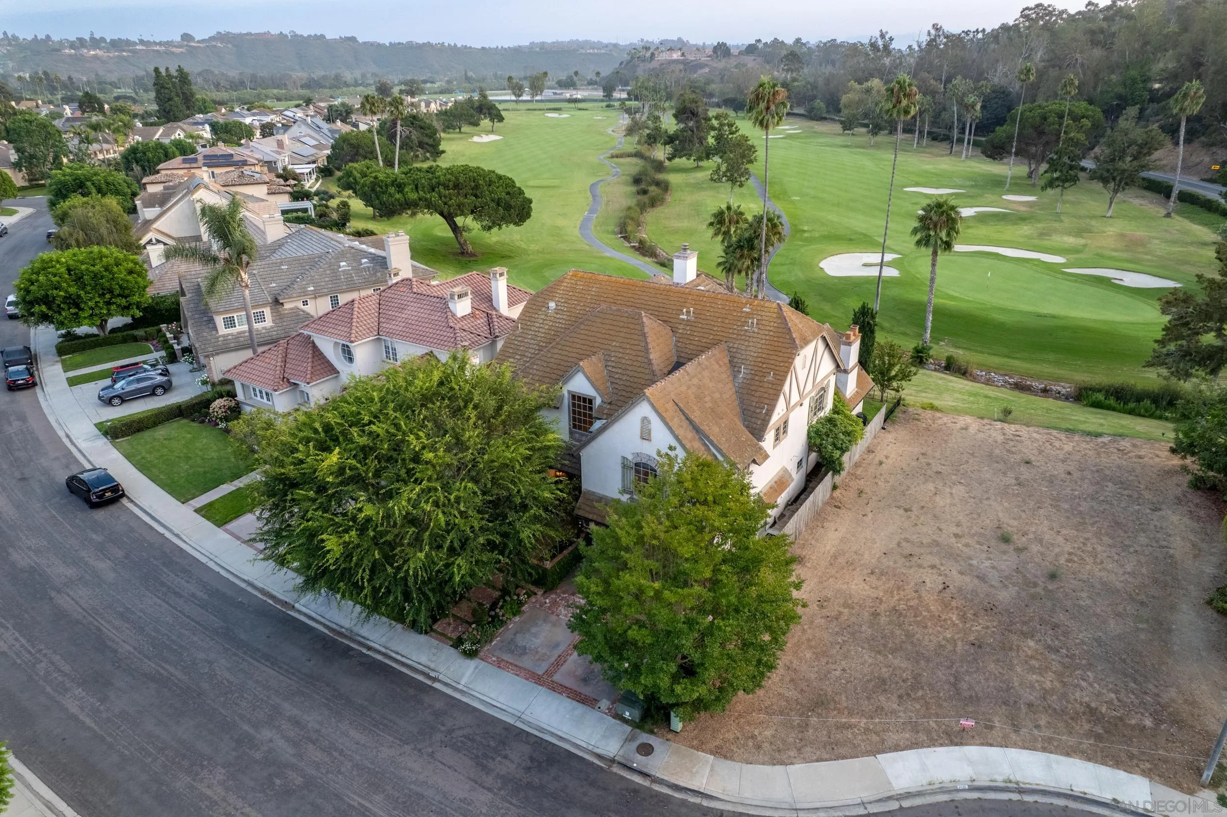 16056 Avenida Calma Rancho Santa Fe, CA 92091 - Photo 51 of 51 an aerial view of green landscape with trees houses and lake view