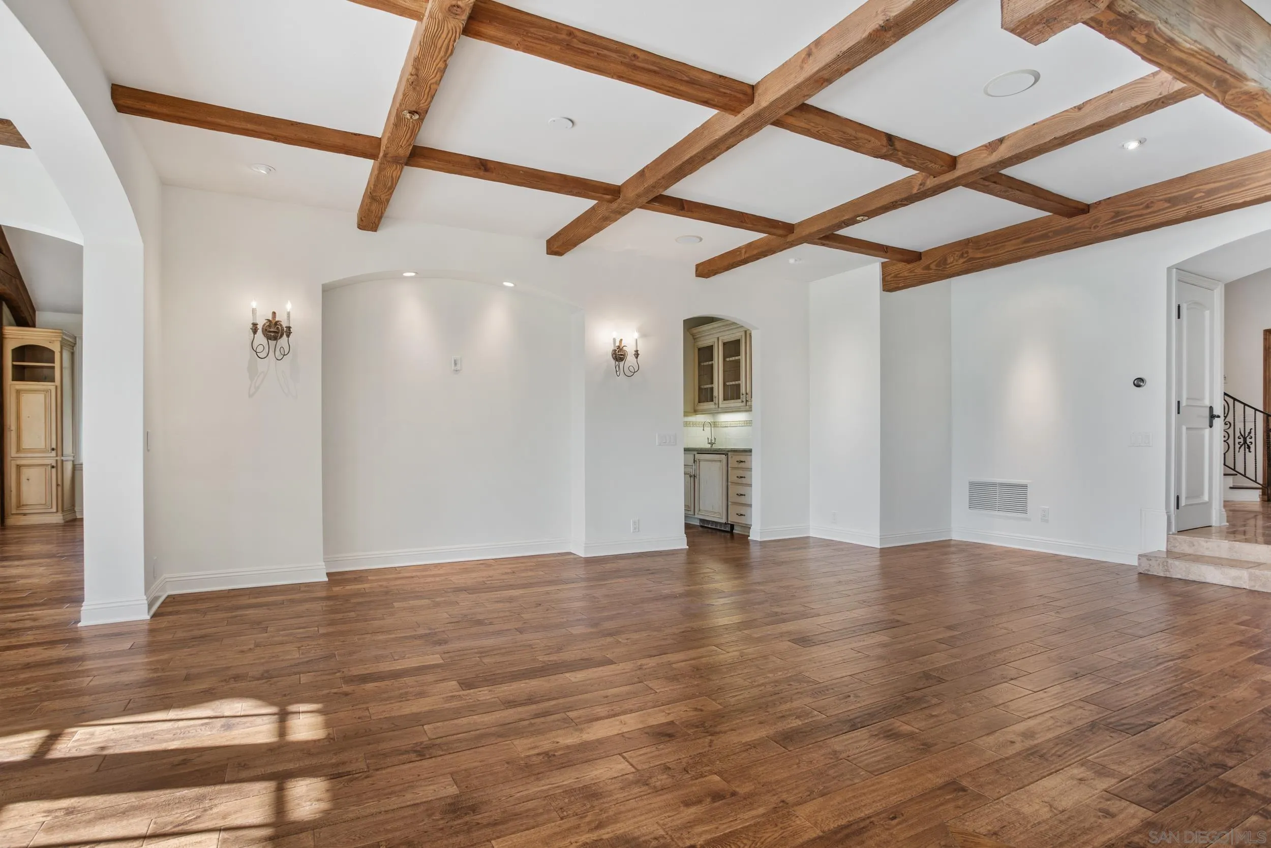 16056 Avenida Calma Rancho Santa Fe, CA 92091 - Photo 6 of 51 a view of an empty room with wooden floor and a window