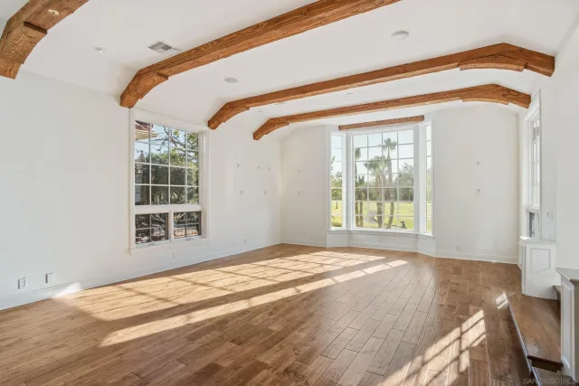 a view of a bedroom with windows