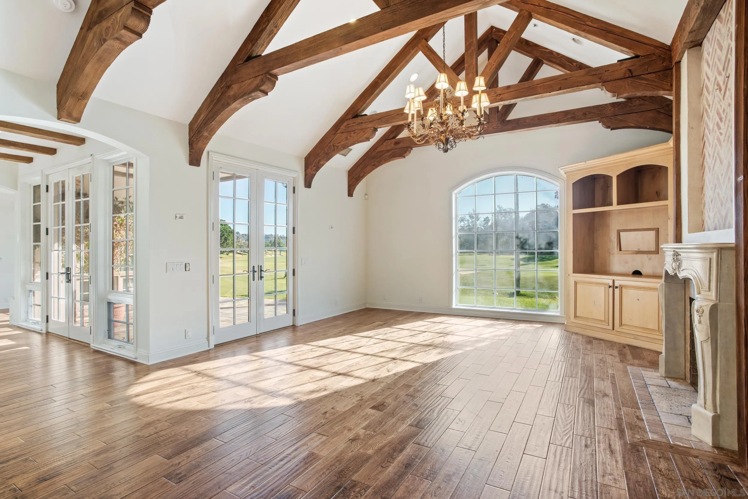 16056 Avenida Calma Rancho Santa Fe, CA 92091 - Photo 9 of 51 a view of an entryway with wooden floor and door