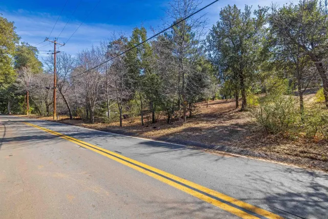 a view of a street with trees