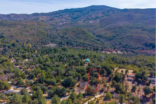 an aerial view of residential house and sandy dunes