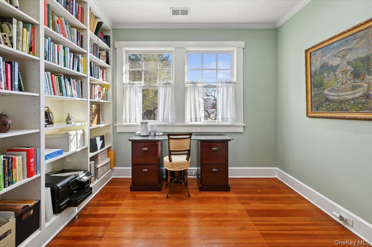 31 Emerson Road Larchmont, NY 10538 - Photo 19 of 39 This office is off of the primary bedroom. Built-in shelving, love of light...perfect for WFH days!