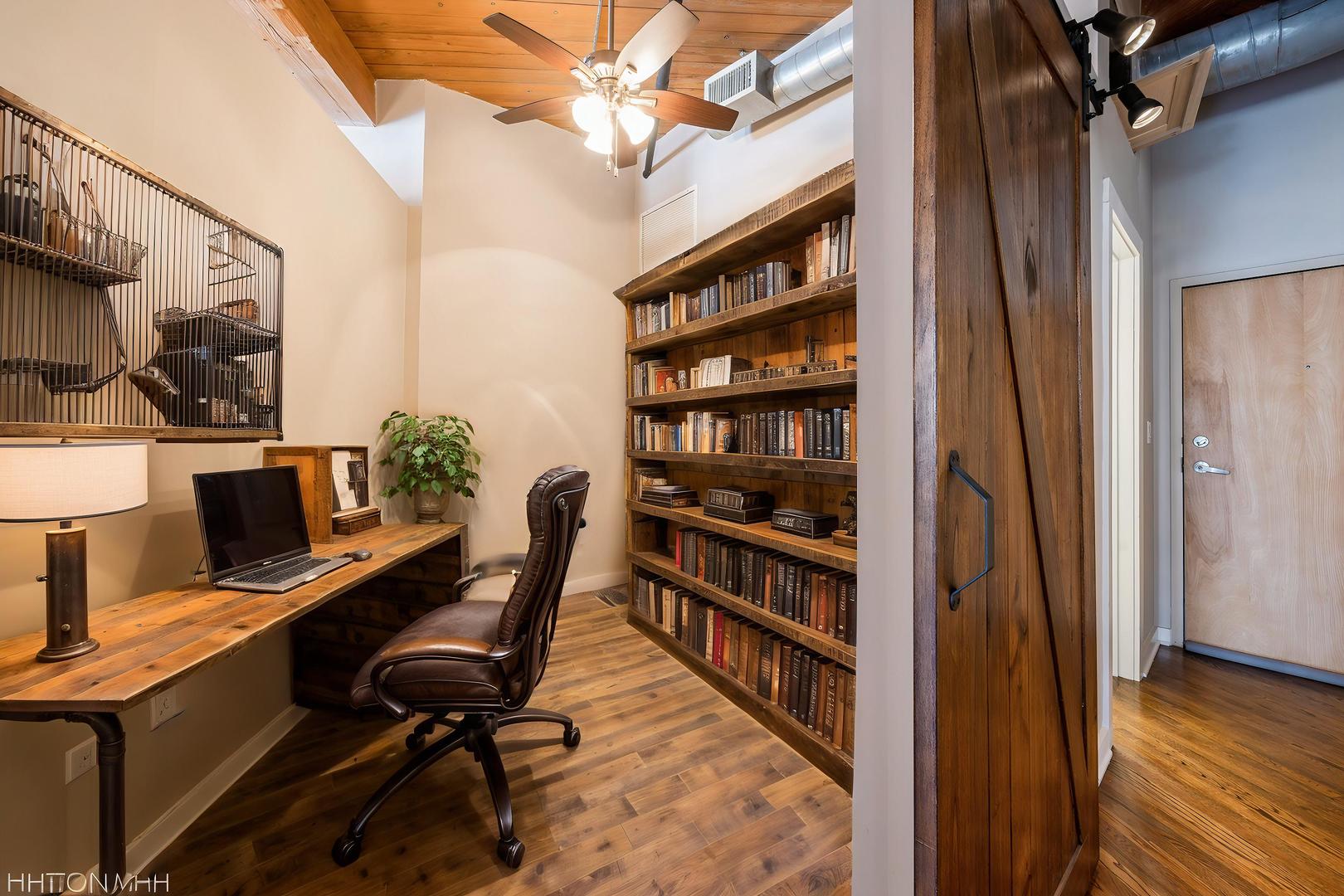 420 South Clinton Street, Unit 617A Chicago, IL 60607 - Photo 11 of 25 a view of a workspace with furniture and a window