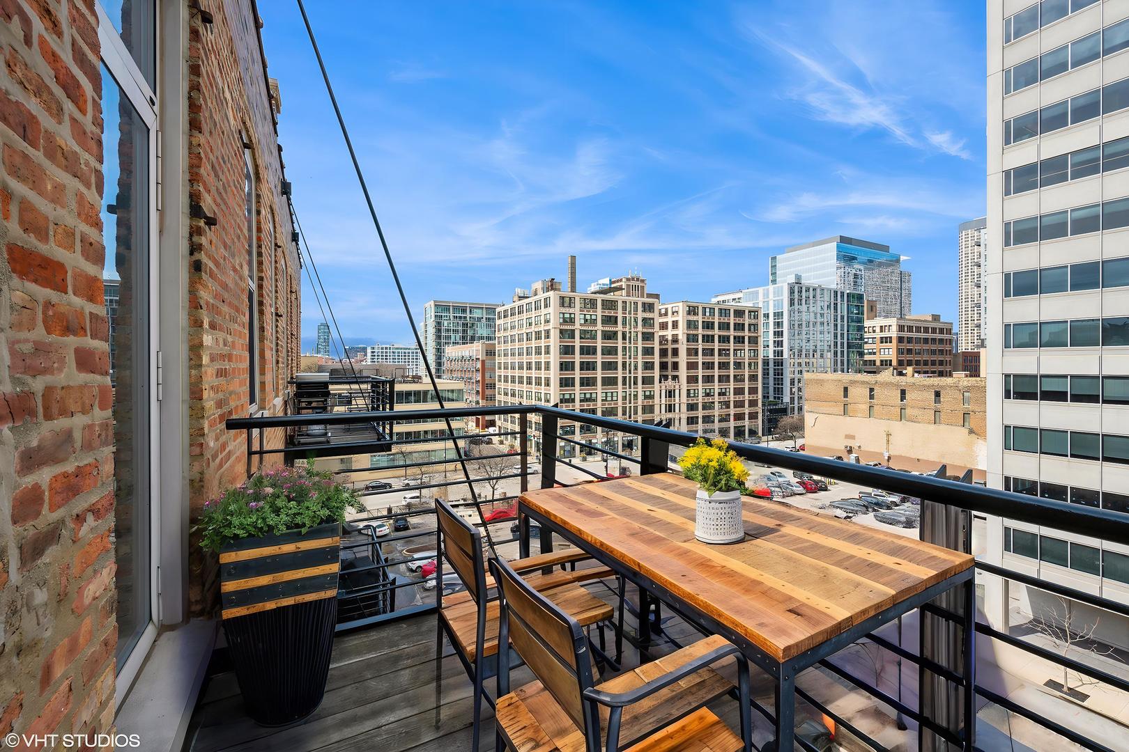 420 South Clinton Street, Unit 617A Chicago, IL 60607 - Photo 16 of 25 a view of a balcony with chairs