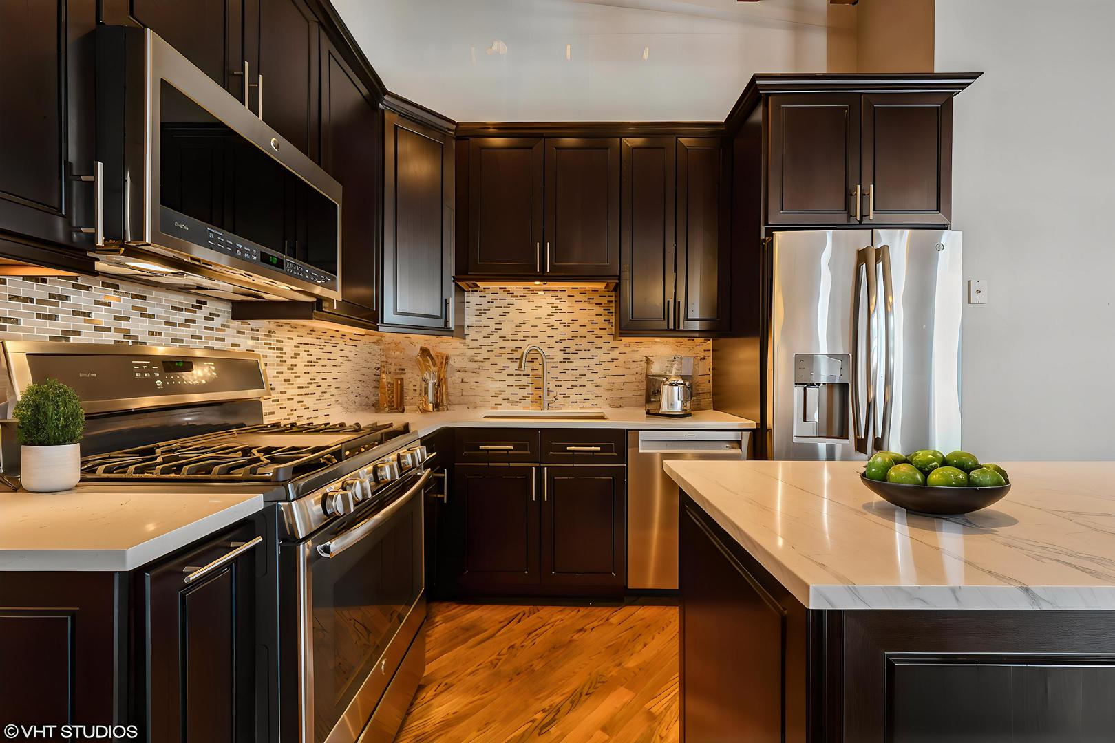 420 South Clinton Street, Unit 617A Chicago, IL 60607 - Photo 6 of 25 a kitchen with stainless steel appliances a sink stove and refrigerator