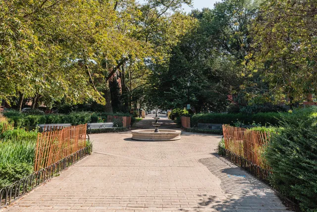 a view of backyard with seating and green space