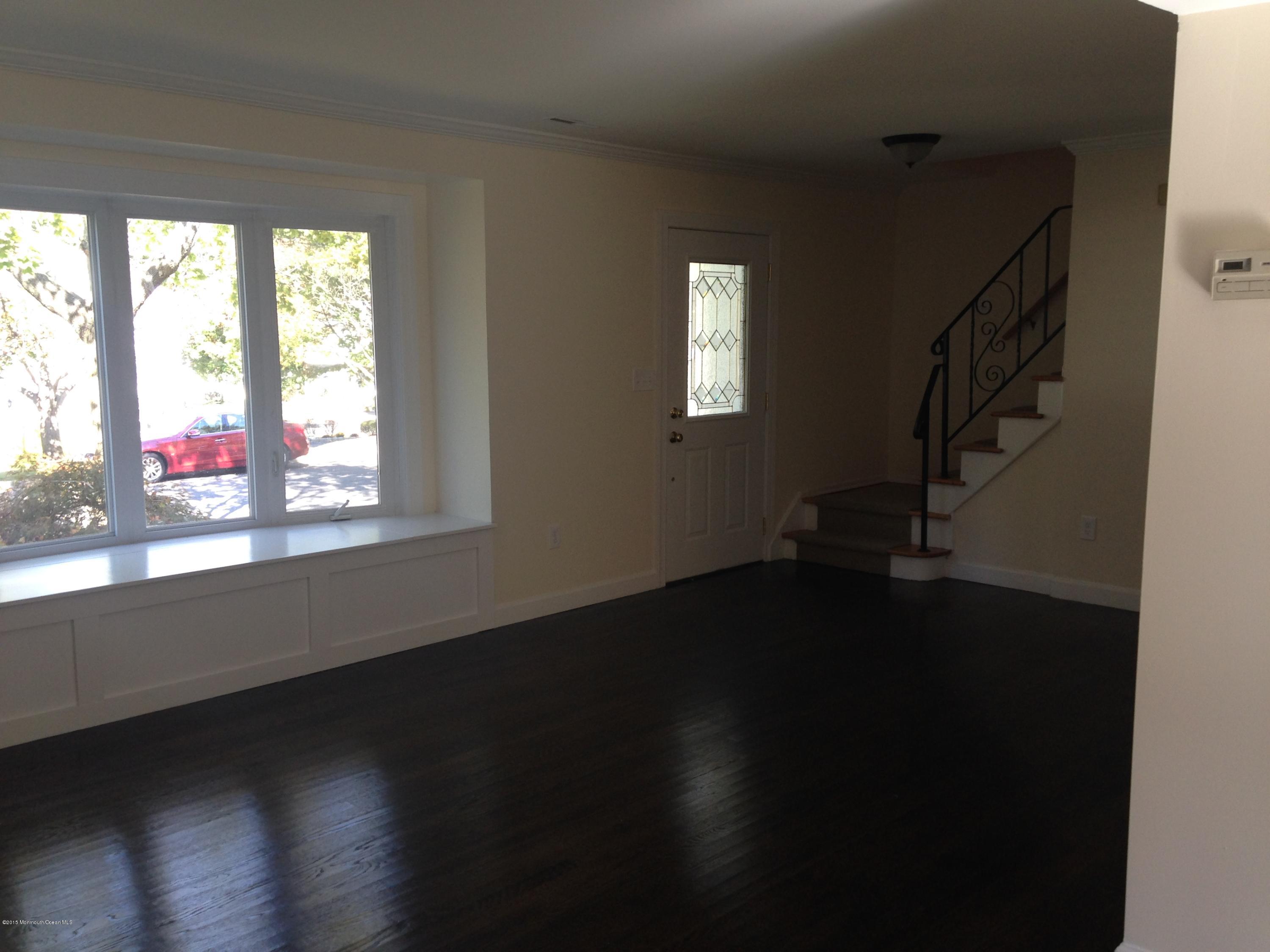 1 Wood Road Hazlet, NJ 07730 - Photo 7 of 12 a view of an entryway with wooden floor and a window
