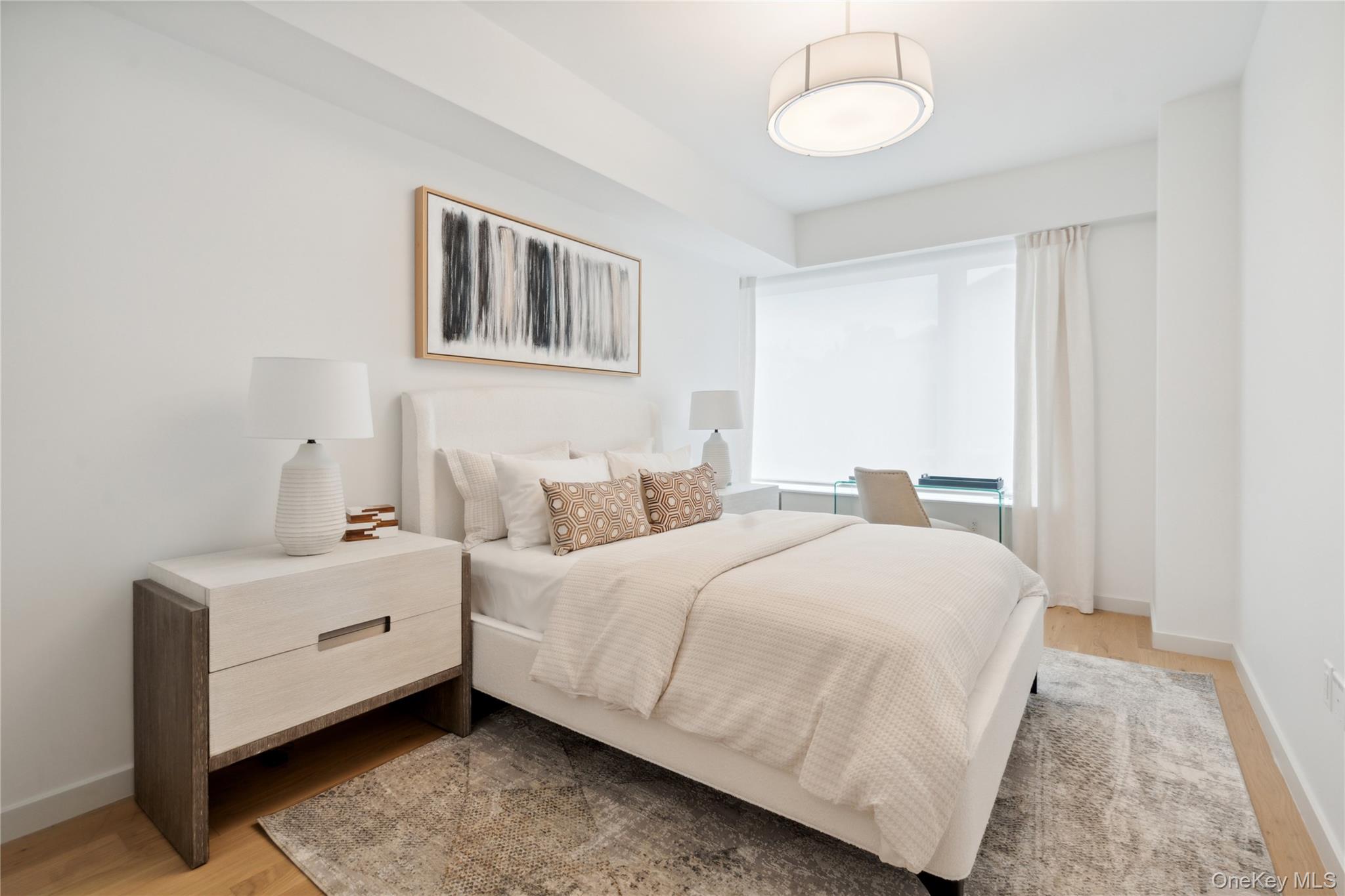 218 Middle Neck Road, Unit 101 Great Neck, NY 11021 - Photo 11 of 37 Bedroom with light wood-type flooring and baseboards