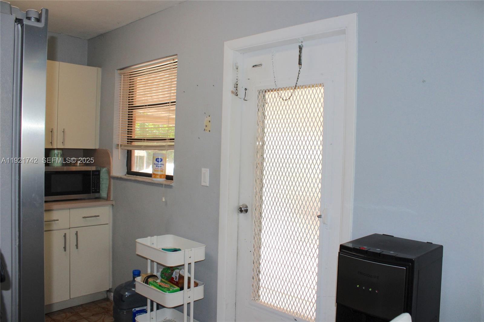 4940 Southwest 114th Avenue Miami, FL 33165 - Photo 12 of 31 a bathroom with a toilet a sink and a window