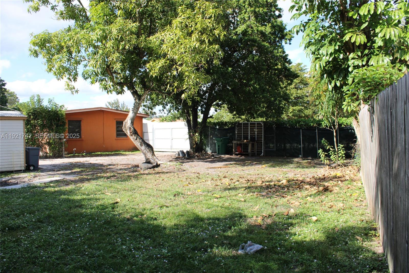 4940 Southwest 114th Avenue Miami, FL 33165 - Photo 26 of 31 a view of a house with a yard and tree