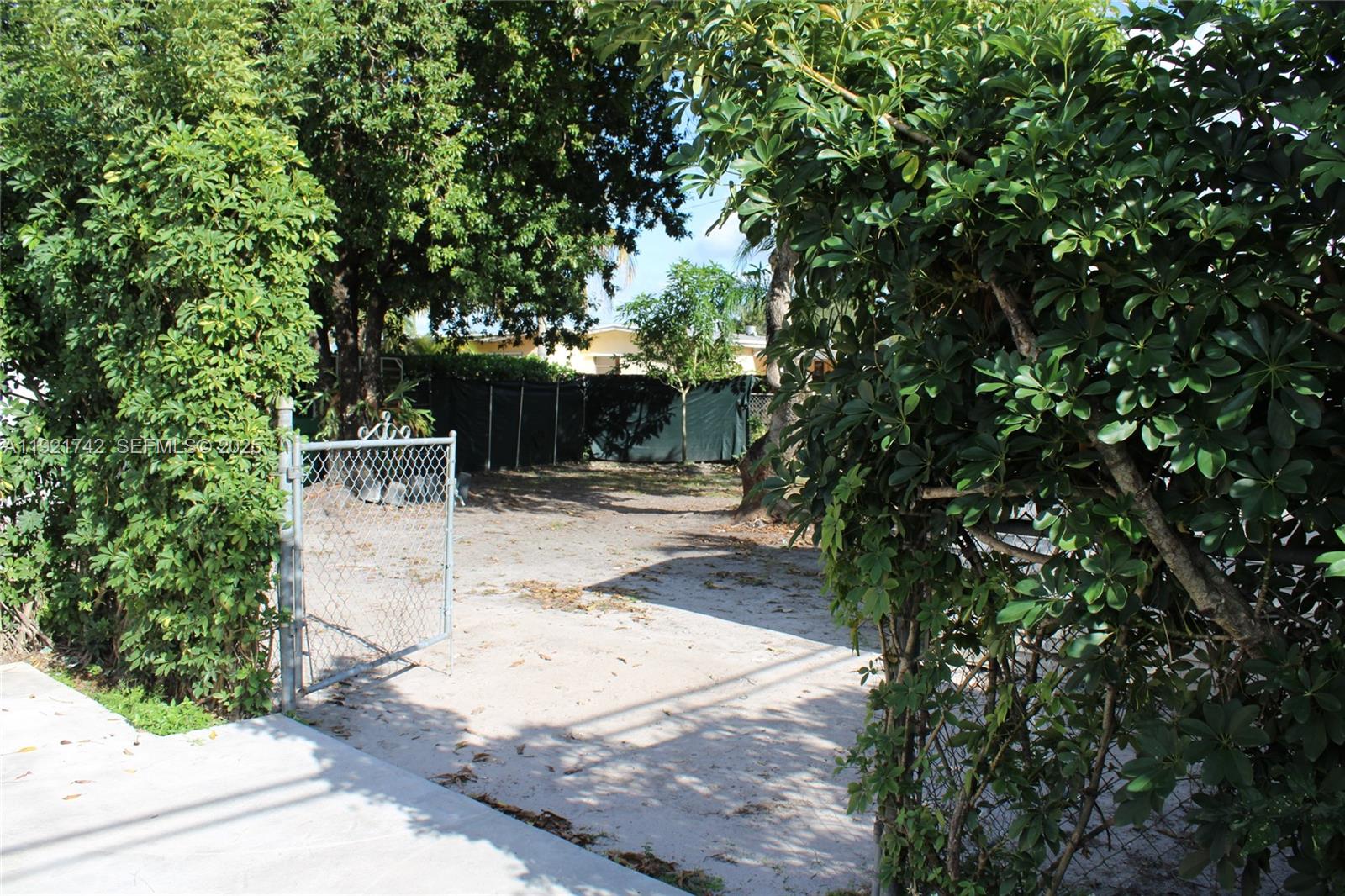 4940 Southwest 114th Avenue Miami, FL 33165 - Photo 28 of 31 a view of backyard with outdoor seating and green space