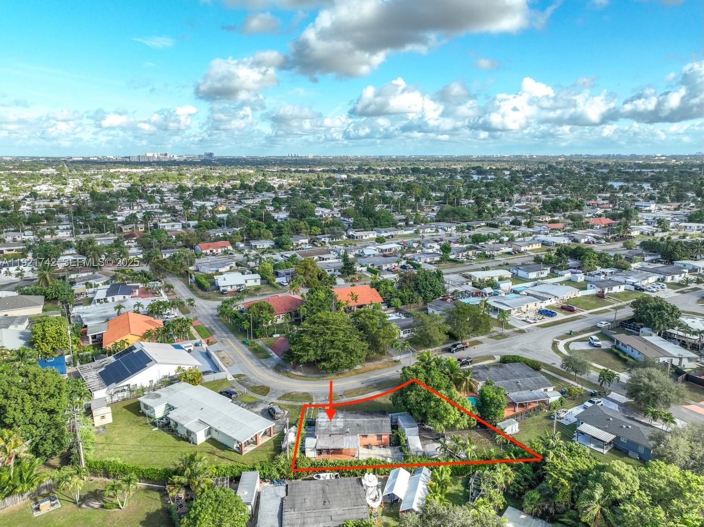 4940 Southwest 114th Avenue Miami, FL 33165 - Photo 29 of 31 a view of a city with lots of residential buildings ocean and mountain view in back