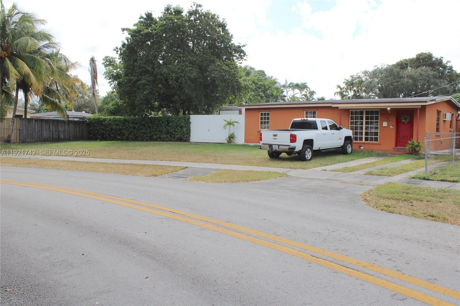 4940 Southwest 114th Avenue Miami, FL 33165 - Photo 3 of 31 a view of a house with truck parked on the road