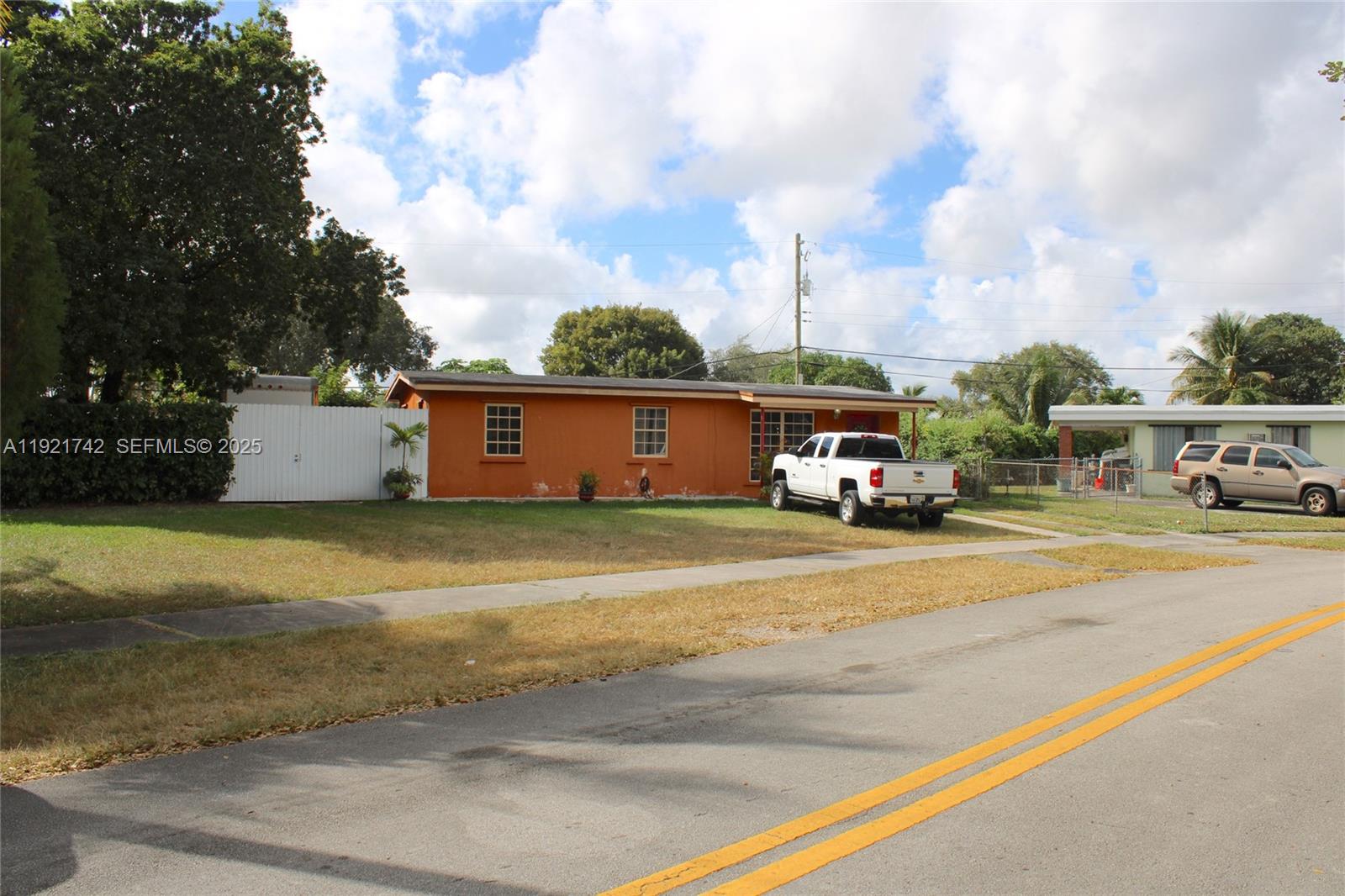 4940 Southwest 114th Avenue Miami, FL 33165 - Photo 5 of 31 a car parked on the side of the street