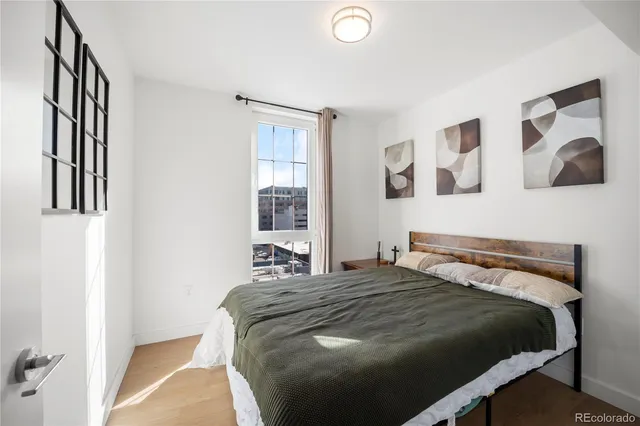 a view of a tall building next to a road