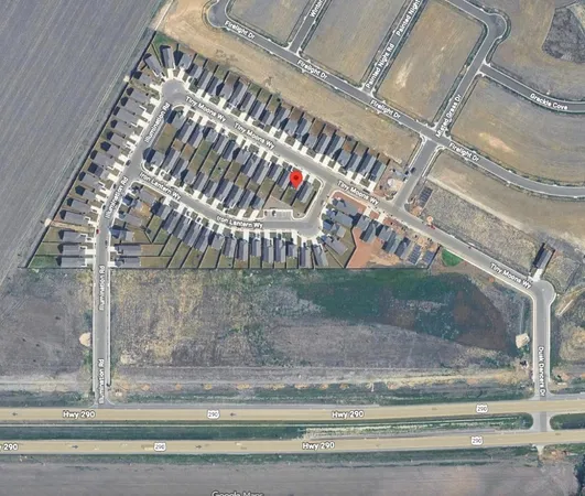 a view of a swimming pool with chair and table