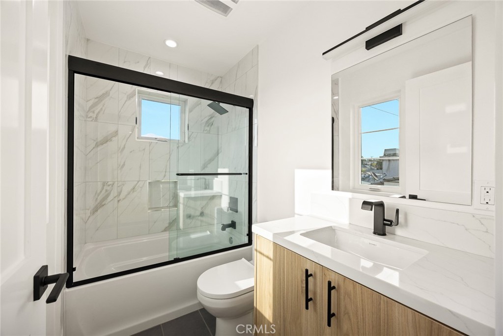 905 Sunset Boulevard, Unit A Arcadia, CA 91007 - Photo 21 of 35 a bathroom with a granite countertop sink toilet and shower