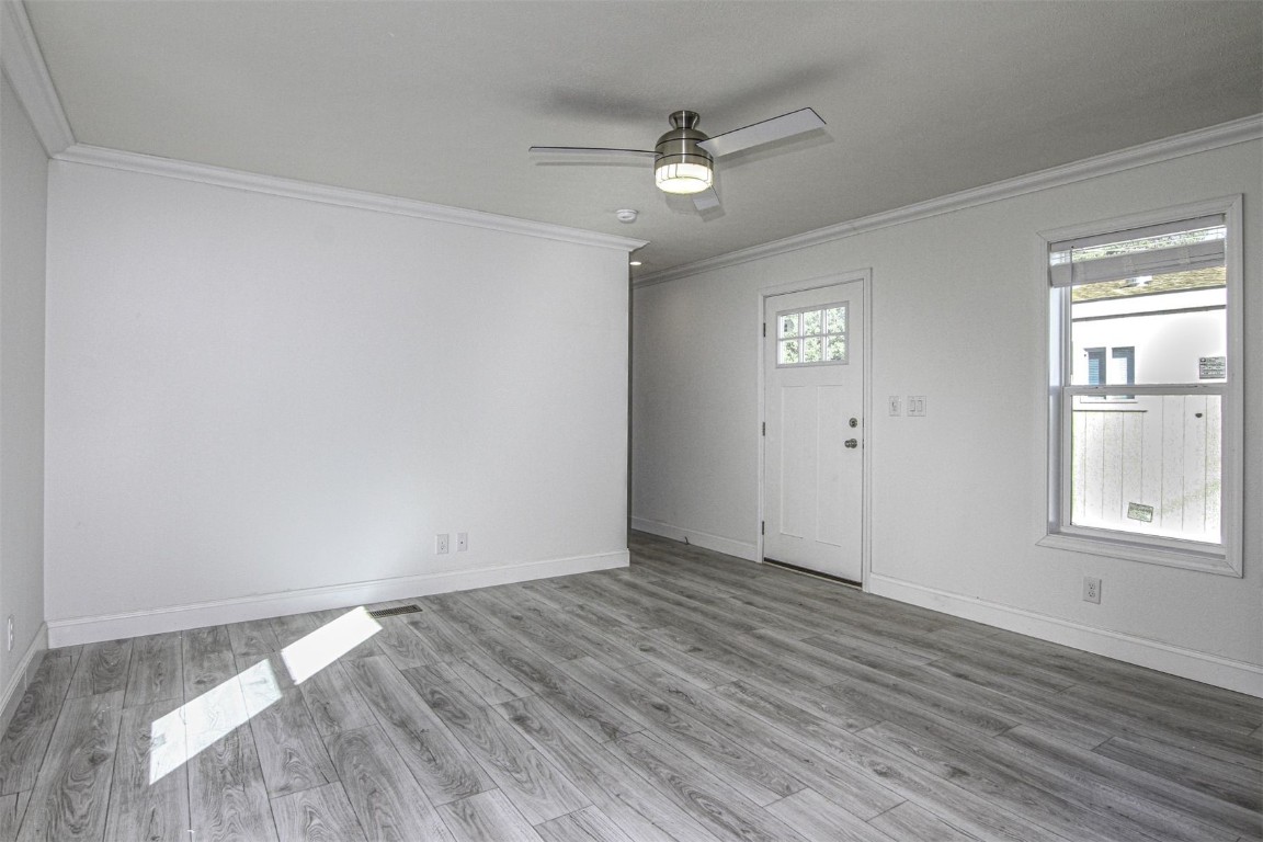 847 Airport Road, Unit 12 Breckenridge, CO 80424 - Photo 2 of 32 a view of an empty room with wooden floor and a window