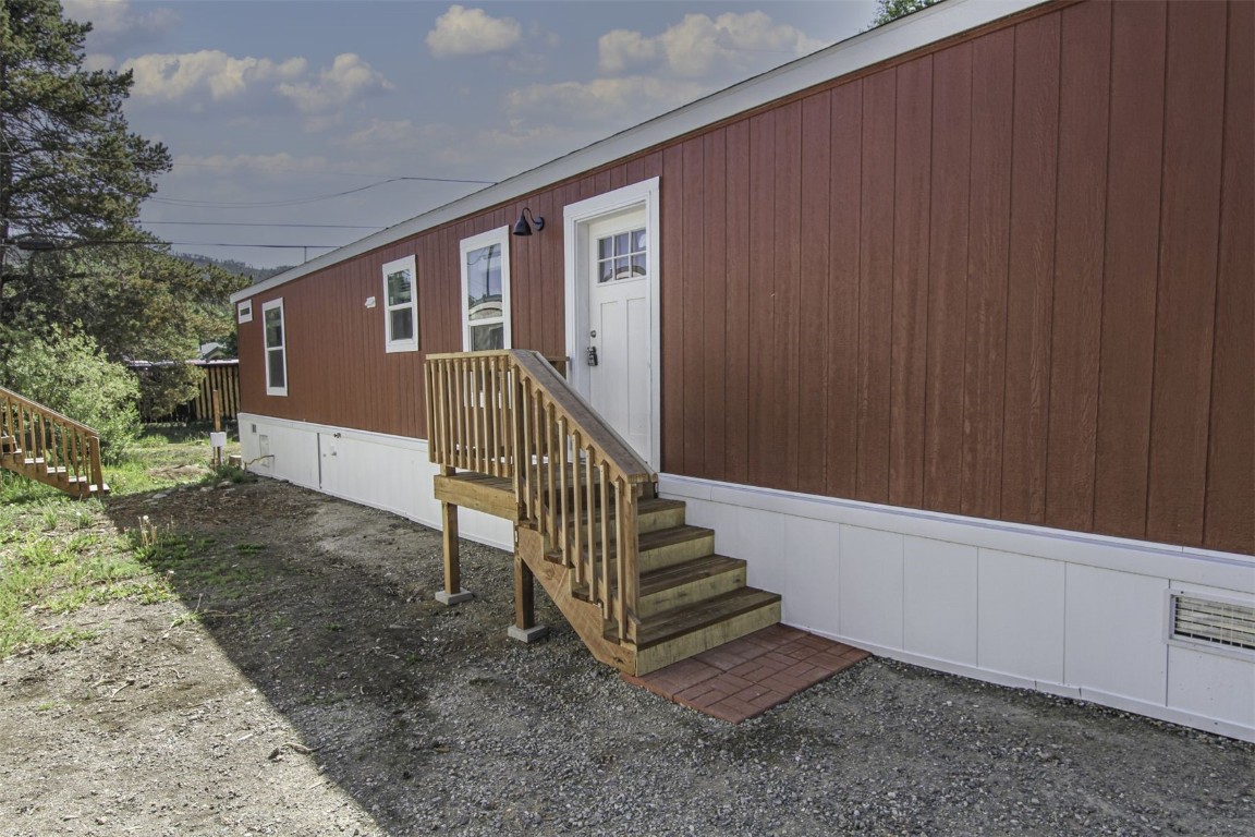 847 Airport Road, Unit 12 Breckenridge, CO 80424 - Photo 4 of 32 a view of a house with backyard and wooden fence