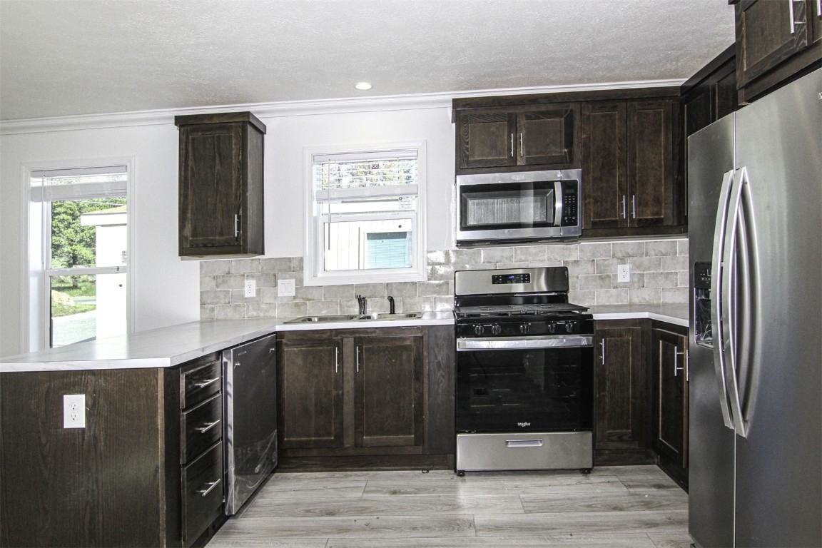 847 Airport Road, Unit 12 Breckenridge, CO 80424 - Photo 5 of 32 a kitchen with a sink stove and refrigerator