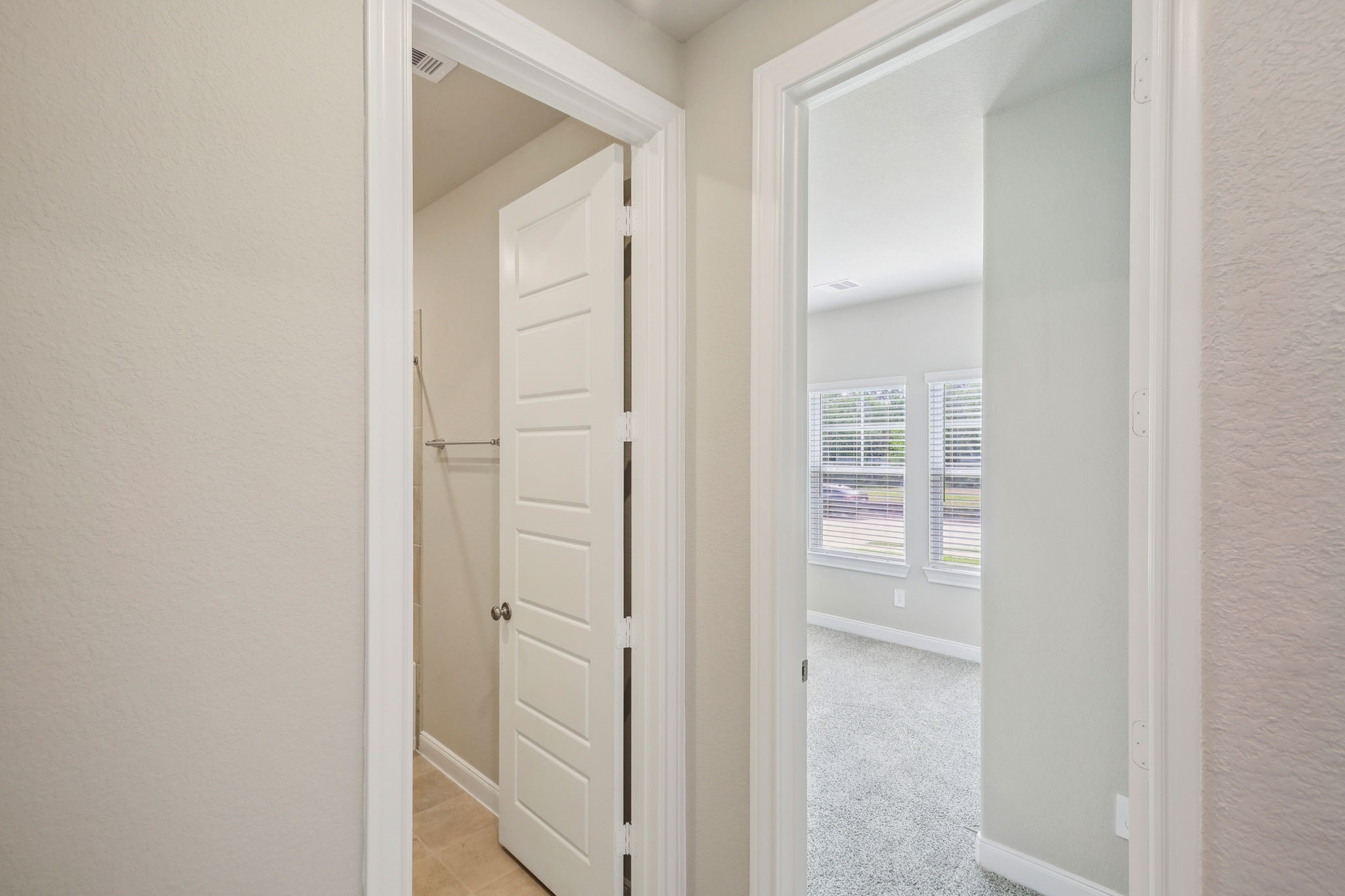 1660 Hopson Ranch Drive Conroe, TX 77301 - Photo 16 of 37 a view of bathroom with a closet and mirror