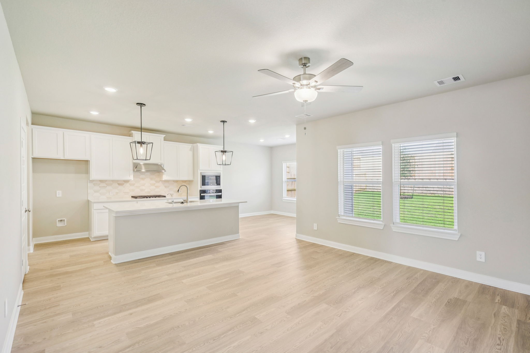 1660 Hopson Ranch Drive Conroe, TX 77301 - Photo 5 of 37 a view of kitchen with kitchen island wooden floor center island and stainless steel appliances
