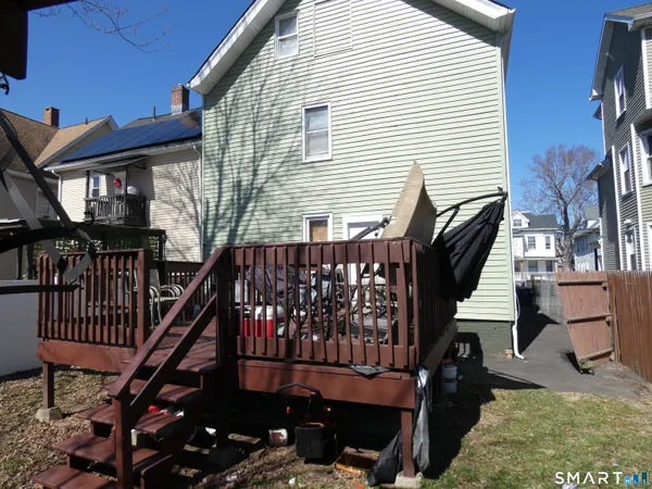 a view of a backyard with sitting area