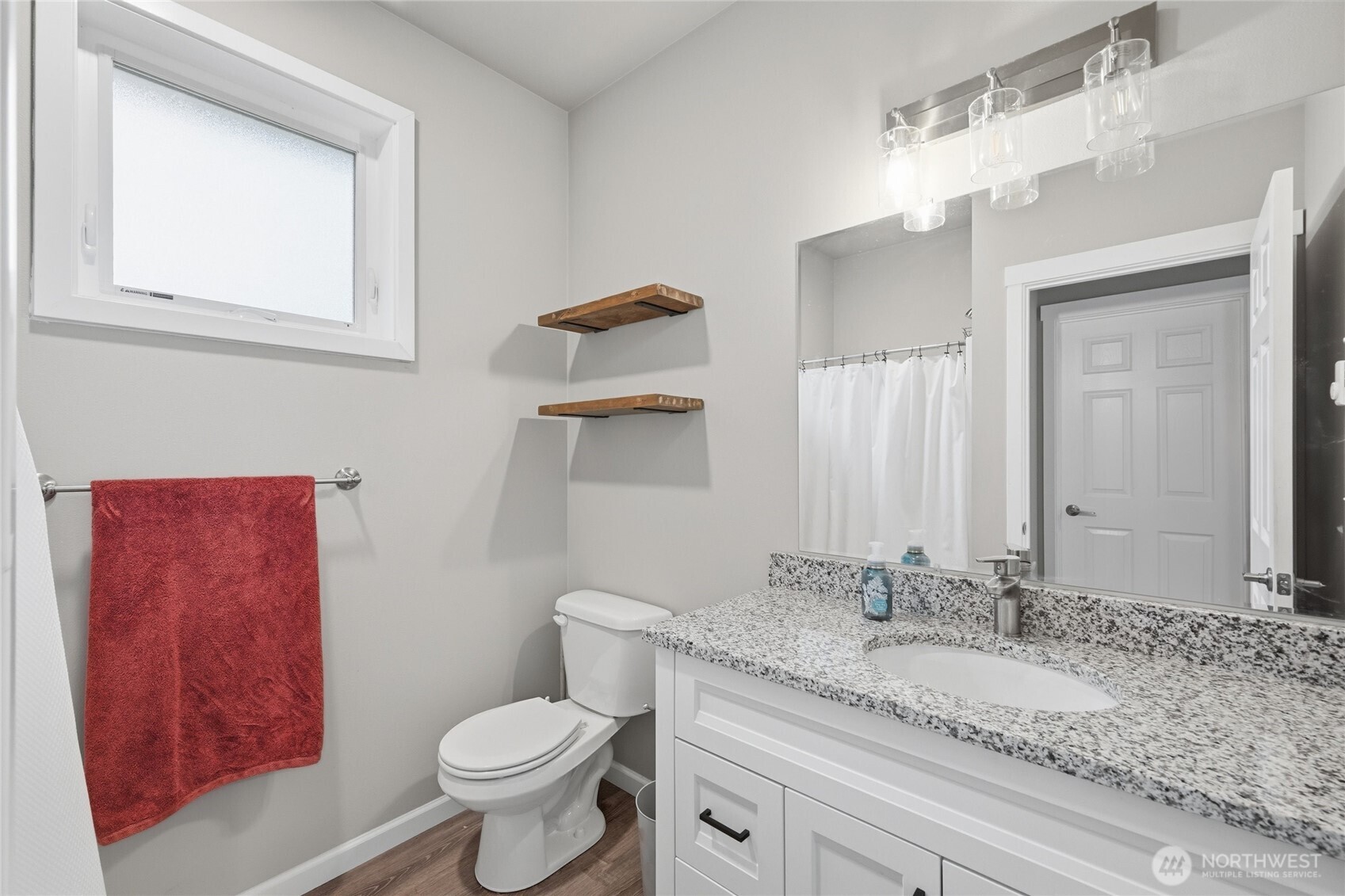 8470 Golden Valley Drive Maple Falls, WA 98266 - Photo 20 of 30 a bathroom with a granite countertop toilet sink and mirror