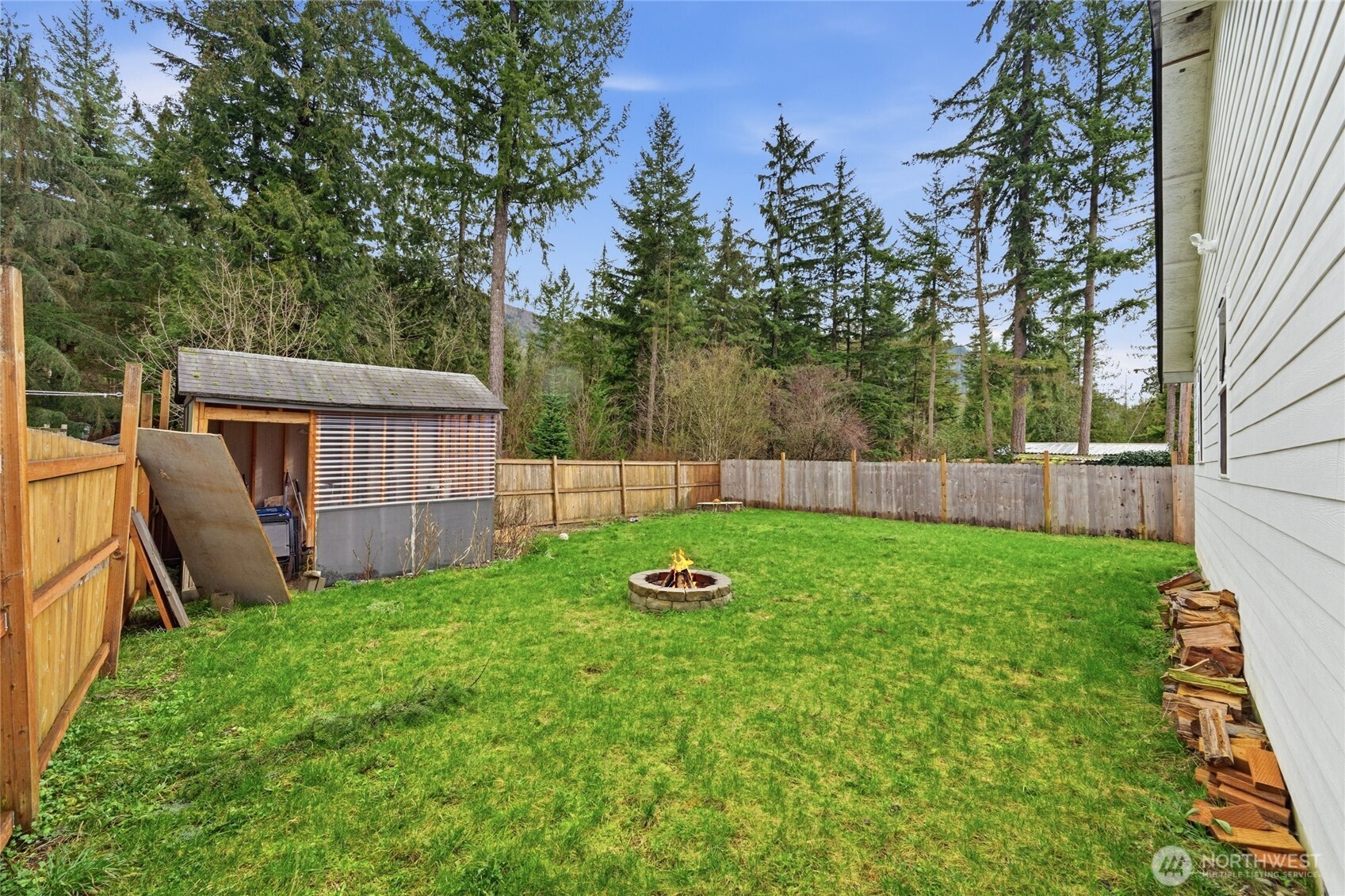 8470 Golden Valley Drive Maple Falls, WA 98266 - Photo 27 of 30 a backyard of a house with lots of green space