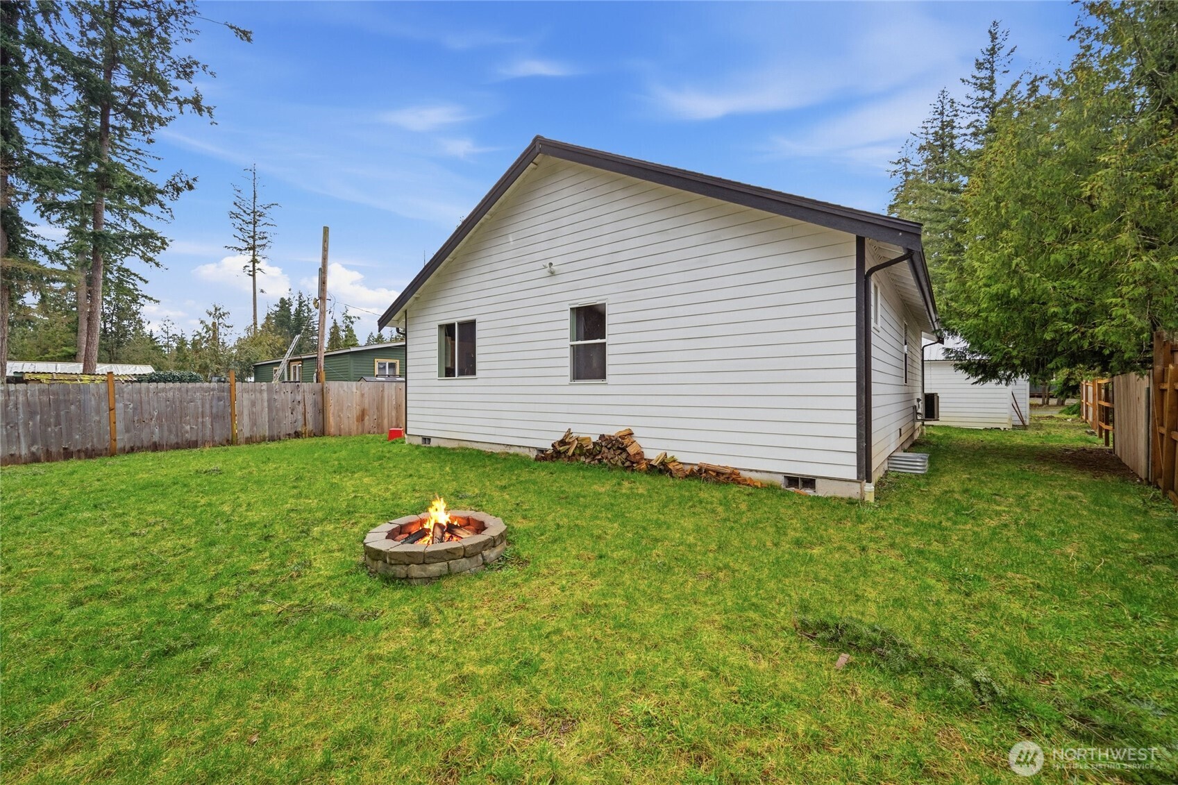 8470 Golden Valley Drive Maple Falls, WA 98266 - Photo 30 of 30 a backyard of a house with a garden and plants