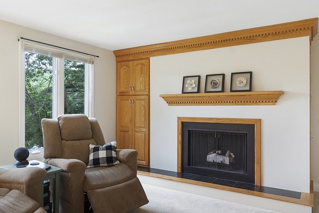 81 Holden Road Shirley, MA 01464 - Photo 8 of 40 a living room with furniture and a fireplace
