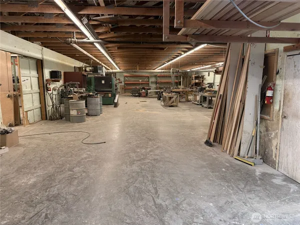 a view of empty room with wooden walls