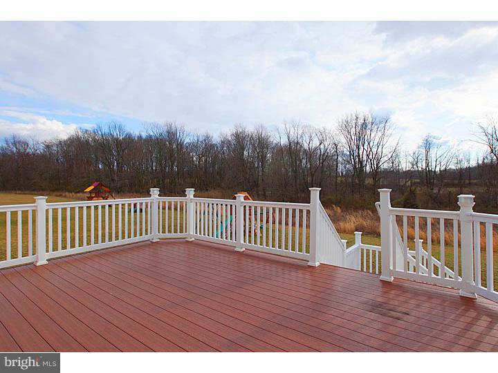 830 Derius Drive Mickleton, NJ 08056 - Photo 2 of 24 a view of deck with wooden floor and fence with a large trees