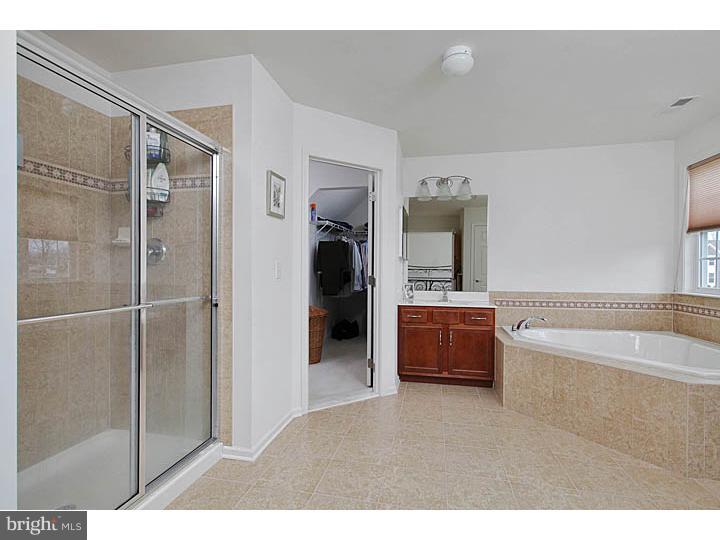 830 Derius Drive Mickleton, NJ 08056 - Photo 16 of 24 a bathroom with a tub shower and sink