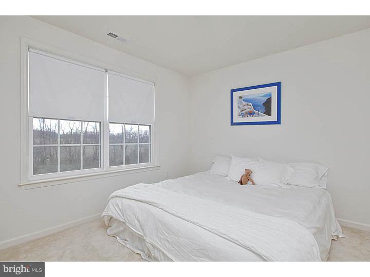 830 Derius Drive Mickleton, NJ 08056 - Photo 20 of 24 a bedroom with a bed and a window